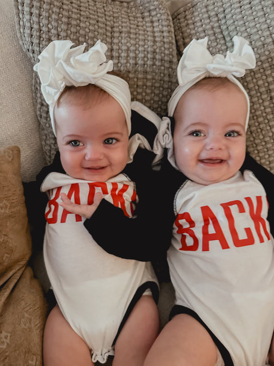 ‘BACKS hooded baby romper